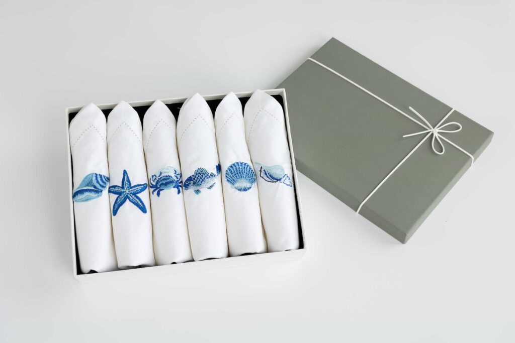 100% high quality cotton linen like texture napkin embroidery ocean collection satin weave six options crab shell sea star fish conch light conch luxury and premium five-star hotels present gift table linen feature picture